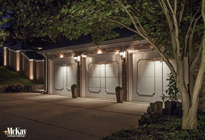 Lighting your garage to add security, safety, and beauty. Click to learn more.. | McKay Landscape Lighting - Omaha, Nebraska