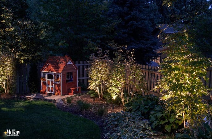 A garden or backyard is a place to unwind while the kids play and catch lightning bugs. Lighting trees and landscaping can expand the premises of your property and showcase your plants while increasing security. Click to read more. | McKay Landscape Lighting Omaha Nebraska 