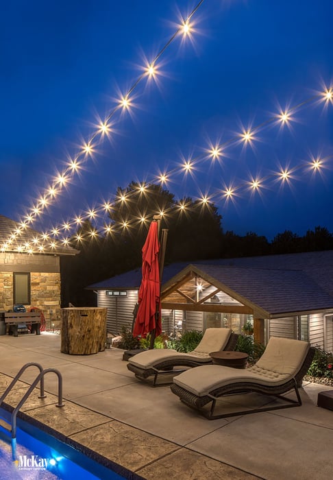 Outdoor Bistro String Lights Around a Pool Omaha Nebraska McKay Landscape Lighting | Above ground pool deck lighting ideas