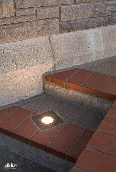 The building is surrounded by concrete which can sometimes make installing well lights difficult. Click to learn more about the commercial landscape lighting design... | McKay Lighting - Omaha, Nebraska 