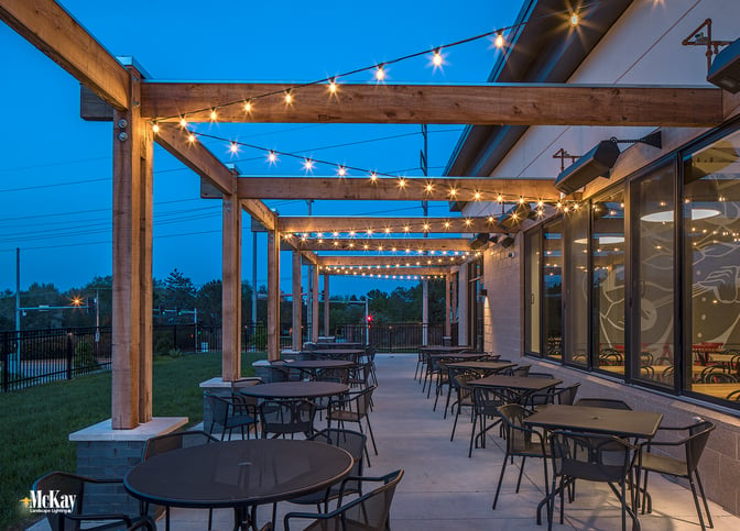 Outdoor String Lights Enhance Restaurant Patio Ambiance Omaha Nebraska | McKay Landscape Lighting