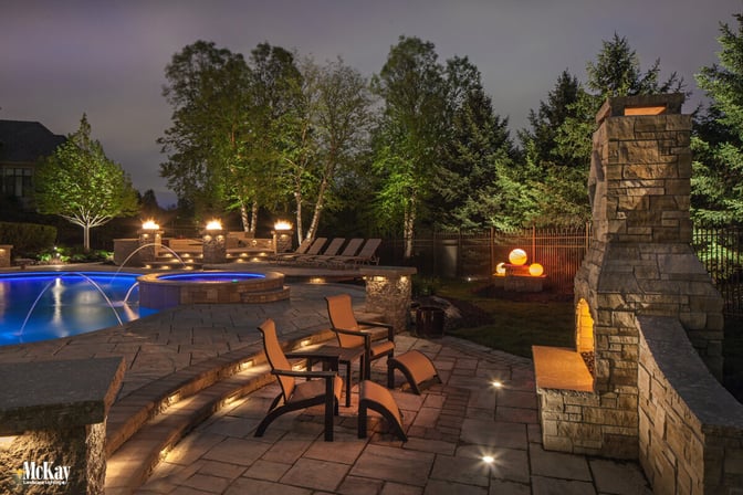 Draw attention to all the intricate hardscaping details of your outdoor fireplace lighting. Click to learn more and see more ideas... | McKay Landscape Lighting - Omaha Nebraska 