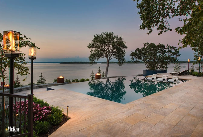 The landscape lighting design adds to the aesthetics of this lakefront estate while increasing the safety throughout. Click to find out more... | McKay Landscape Lighting, Omaha, Nebraska