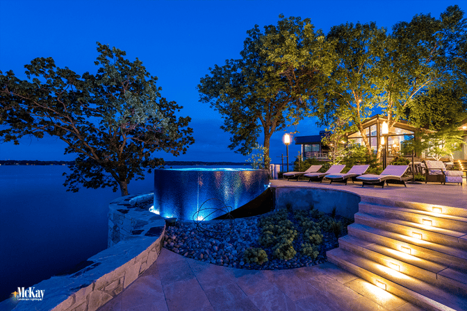 Shouldn’t your lake home be a place that draws you in and encourages more of these late night memories? Landscape lighting can add ambiance and extend your time in your outdoor spaces while adding safety and security. Click to see more lake home lighting ideas... | McKay Landscape Lighting - Omaha, Nebraska 