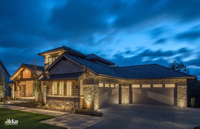 The home has a front and side load garage. This area isn't noticeable from the front of the house or inside of the home, but becomes the main focal point when you enter into the driveway.  Outdoor garage security lighting provides a comprehensive overall look and creates balance with the rest of the house. Click to learn more... | McKay Landscape Lighting - Omaha Nebraska