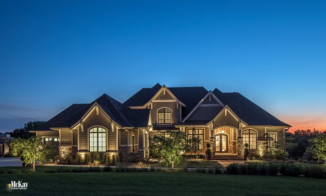 There’s nothing quite like driving up to a warm, welcoming home with the prettiest Nebraska sunset peeking through the trees in the backdrop. This gorgeous new home is nestled in a serene location outside of Omaha, surrounded by the wonders of nature and picturesque views. Click to learn more about the residential landscape lighting design... | McKay Lighting - Omaha, Nebraska