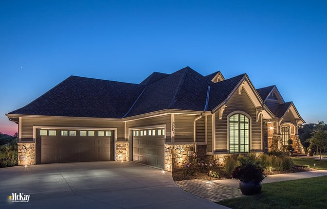 The garage is off to the side and not visible from the front door. Without light, the garage would be very dark and would have left the homeowners vulnerable. Click to learn more about this outdoor lighting design... | McKay Landscape Lighting - Omaha, Nebraska