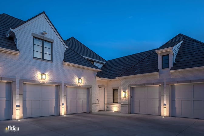 In-ground well lights are a great option because it beautifully illuminates and enhances while increasing the security of the garage. Click to read more... | McKay Landscape Lighting - Omaha, Nebraska 