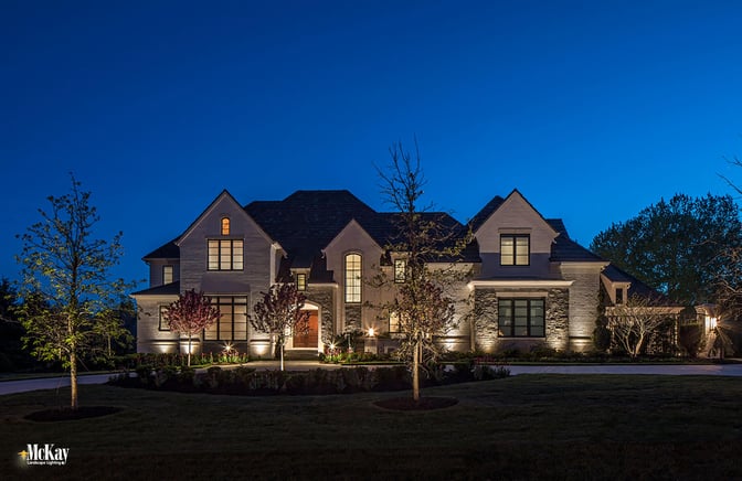 This landscape lighting design enhances the home's timeless beauty while adding a layer of security, which was important for the homeowners. Click to read more... | McKay Landscape Lighting - Omaha, Nebraska